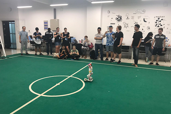 Watching the robots playing football